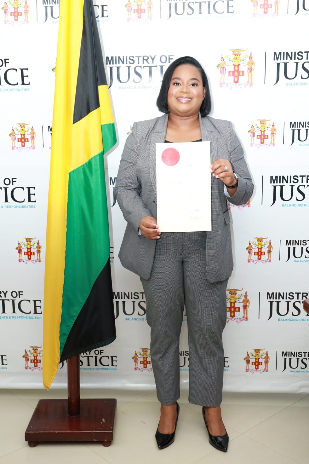 Reneé Malcolm Robertson at the Ministry of Justice with the Writ of Dedimus